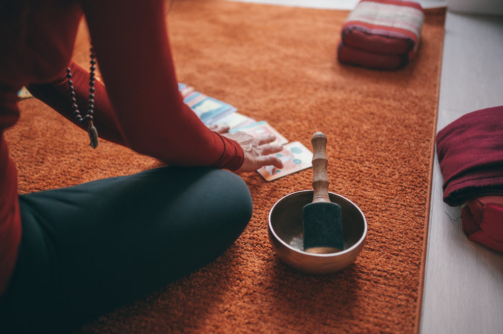 woman laying out tarot cards